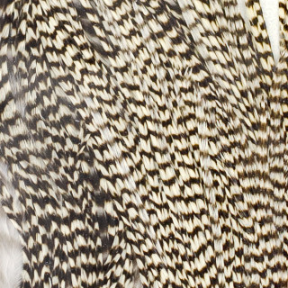 Grizzly cock half saddle